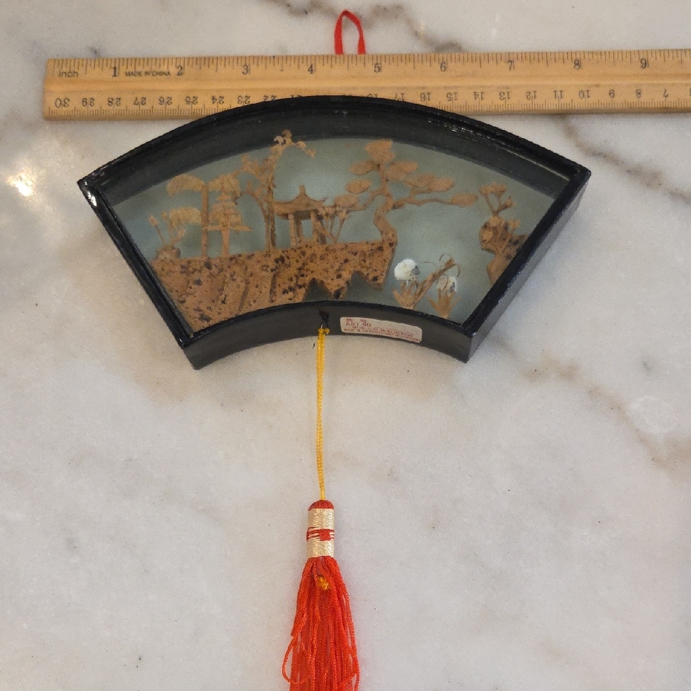 Decorative Fan-Shaped Wall Art with Red Tassel